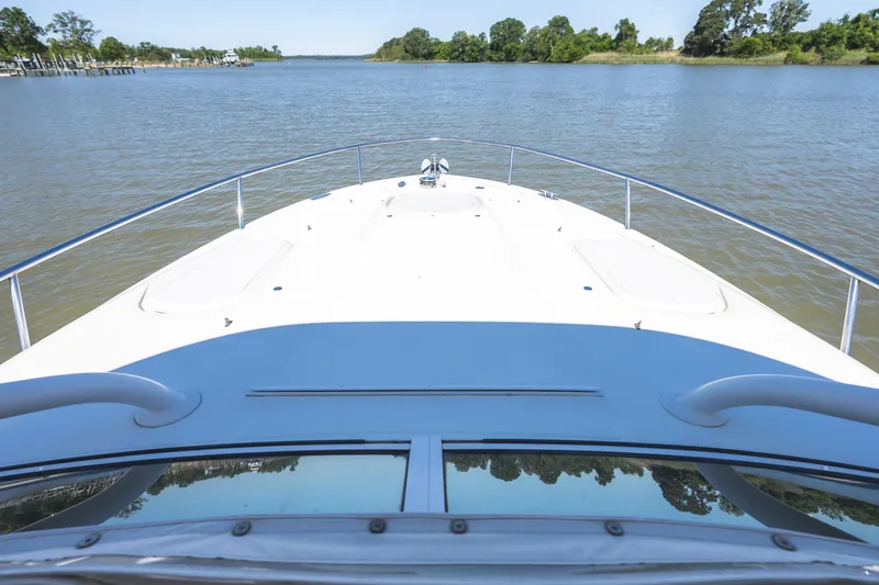 Slide: The Image of Bow view of 2008 Hydrosport 3500 VX boat on a calm river. - 28