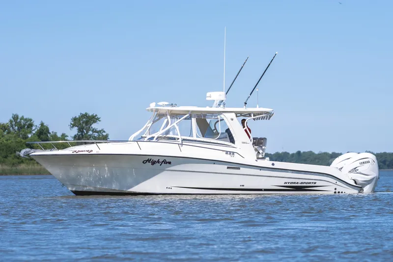 Slide: The Image of 2008 Hydrosport 3500 VX boat on calm water, side view. - 5