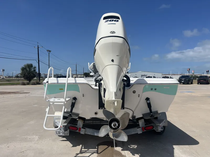 Slide: The Image of Rear view of a 2017 Blue Wave 2300 boat with outboard motor. - 9