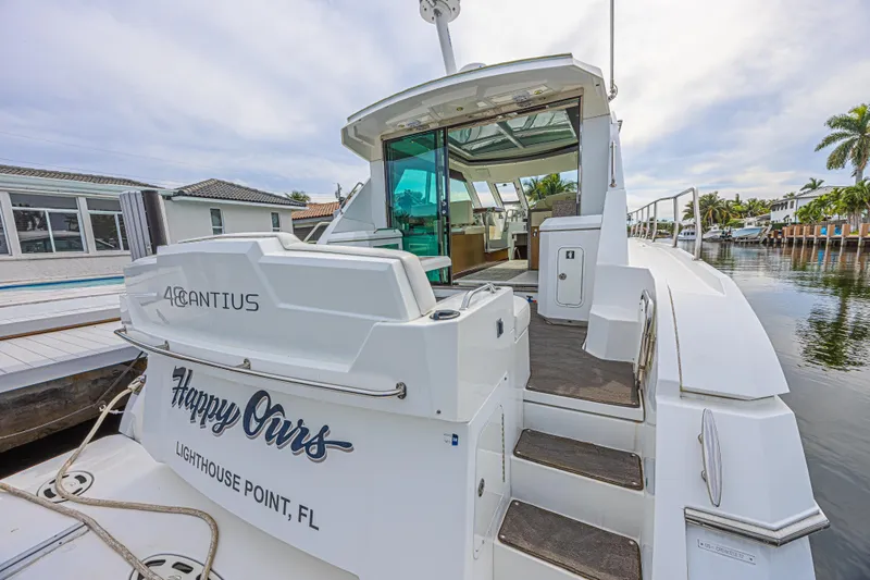 Slide: The Image of 2012 Cruisers Yachts 48 Cantius docked, featuring "Happy Ours" at Lighthouse Point, FL. - 14