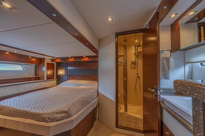 Slide: The Image of Luxurious 2012 Cruisers Yachts 48 Cantius cabin with elegant wood finishes and ensuite bathroom. - 36