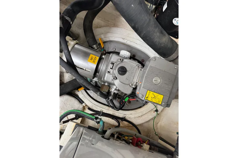 Slide: The Image of Engine compartment of 2012 Cruisers Yachts 48 Cantius with visible mechanical components. - 60