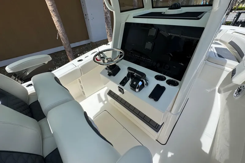 Slide: The Image of Interior view of 2026 Pioneer 250 Pelagic boat cockpit with modern controls and seating. - 13