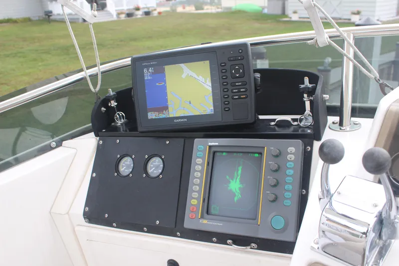 Slide: The Image of 1995 Blackfin 29 Flybridge dashboard with navigation equipment and controls. - 10