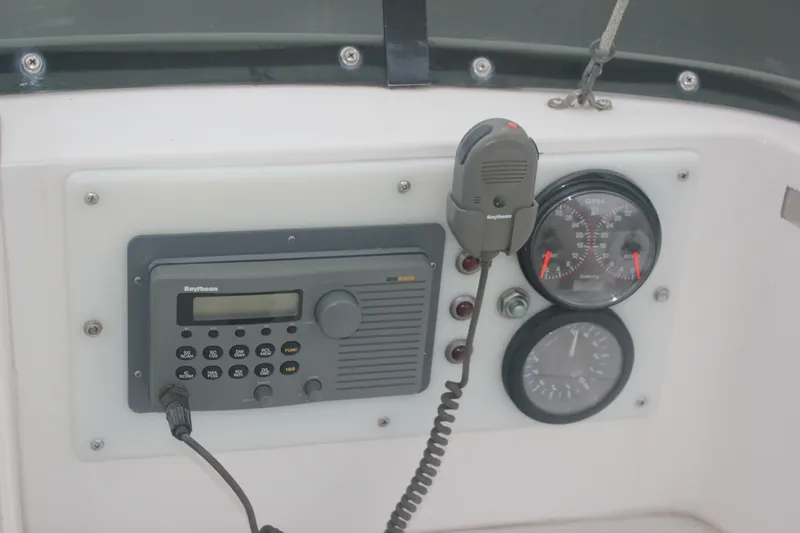 Slide: The Image of Control panel of a 1995 Blackfin 29 Flybridge with radio and gauges. - 11