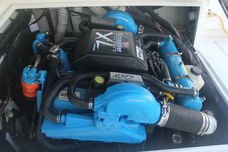 Slide: The Image of Engine compartment of a 1995 Blackfin 29 Flybridge boat, featuring a Crusader XL engine. - 3