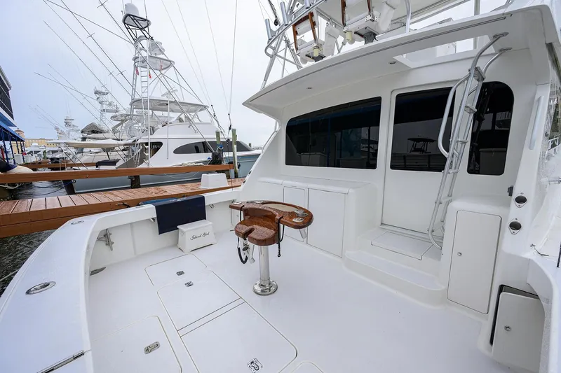 Slide: The Image of 2004 Viking 48 Convertible yacht with spacious deck and fishing chair. - 64