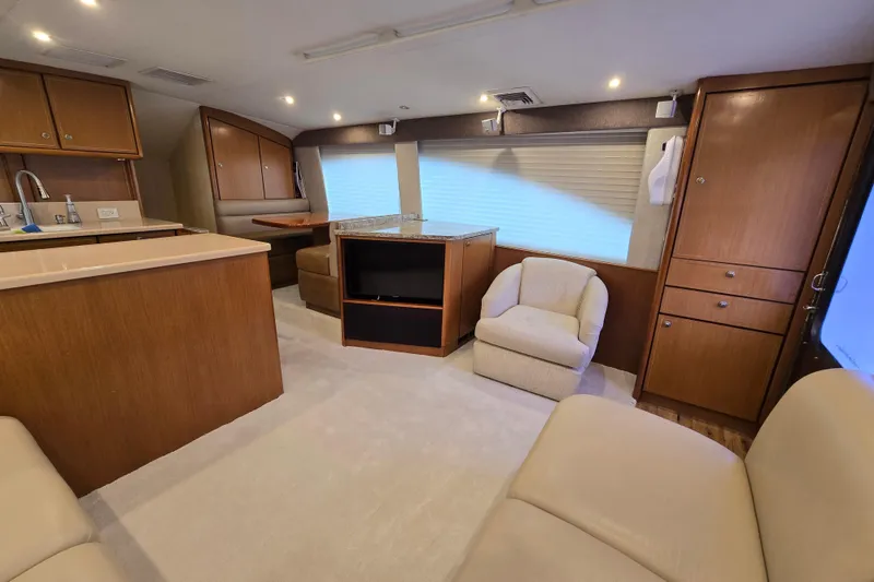 Slide: The Image of Luxurious interior of 2004 Ocean Yachts 50 Super Sport with elegant wood cabinetry. - 11