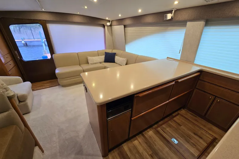 Slide: The Image of Luxurious interior of 2004 Ocean Yachts 50 Super Sport with modern kitchen and seating area. - 13
