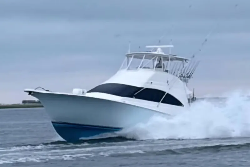 Slide: The Image of 2004 Ocean Yachts 50 Super Sport cruising on open water. - 2