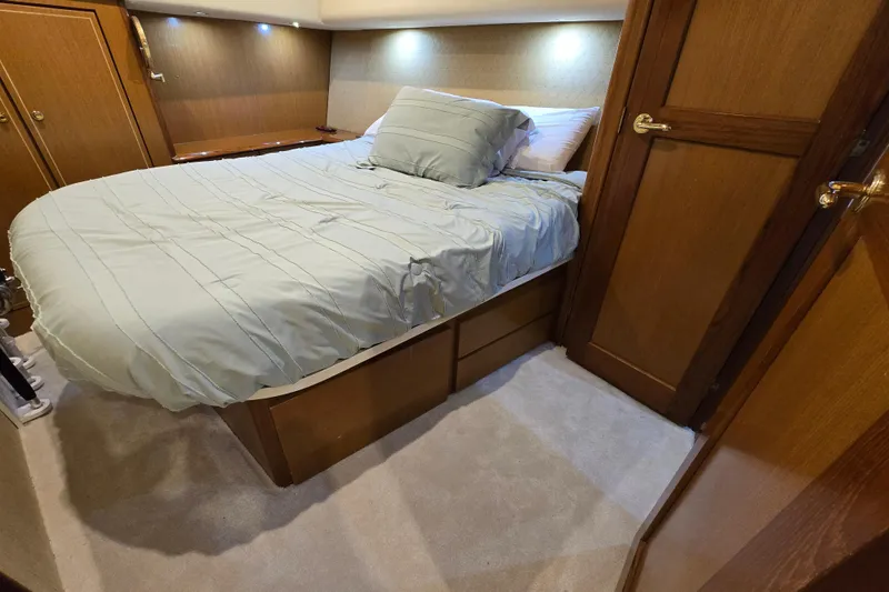 Slide: The Image of Luxurious bedroom interior of 2004 Ocean Yachts 50 Super Sport with cozy bedding. - 22
