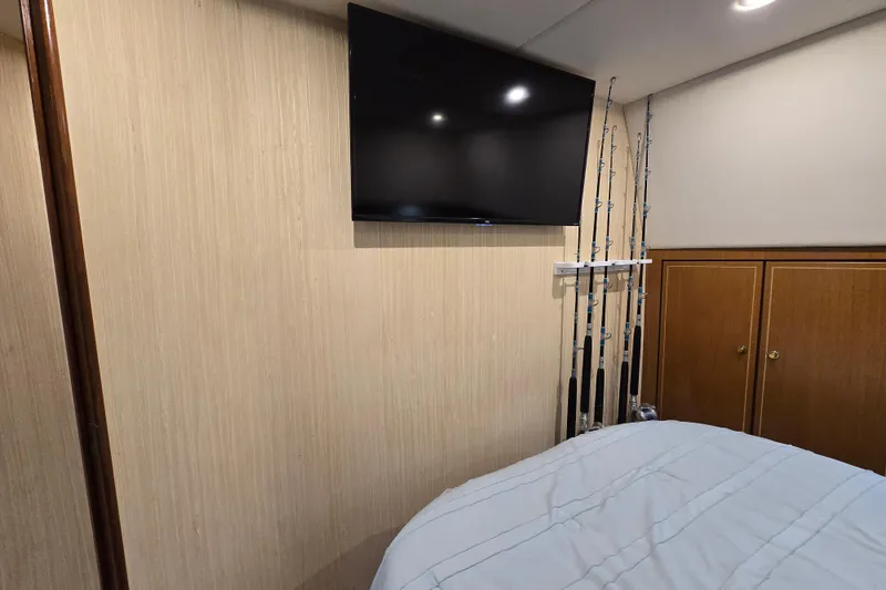 Slide: The Image of Interior of 2004 Ocean Yachts 50 Super Sport with TV and fishing rods. - 23