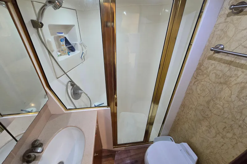 Slide: The Image of Bathroom interior of 2004 Ocean Yachts 50 Super Sport with shower and sink. - 25