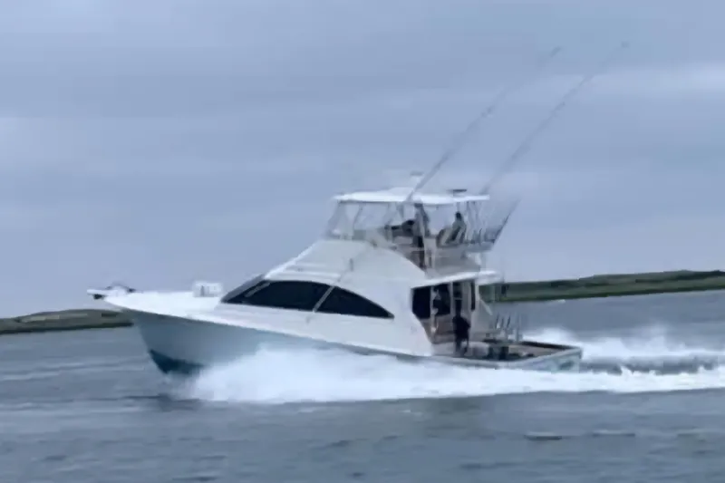 Slide: The Image of 2004 Ocean Yachts 50 Super Sport cruising on open water. - 3