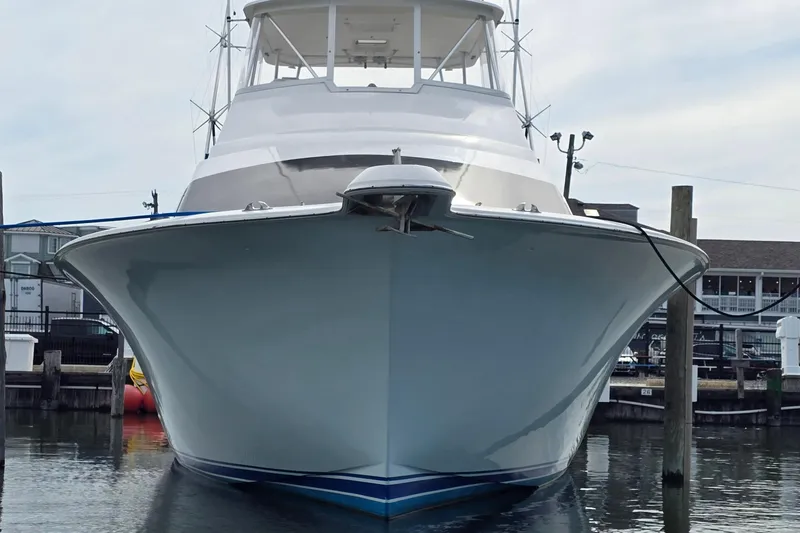 Slide: The Image of Front view of a 2004 Ocean Yachts 50 Super Sport docked at a marina. - 4