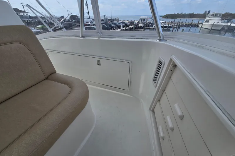 Slide: The Image of 2004 Ocean Yachts 50 Super Sport interior with seating and marina view. - 43