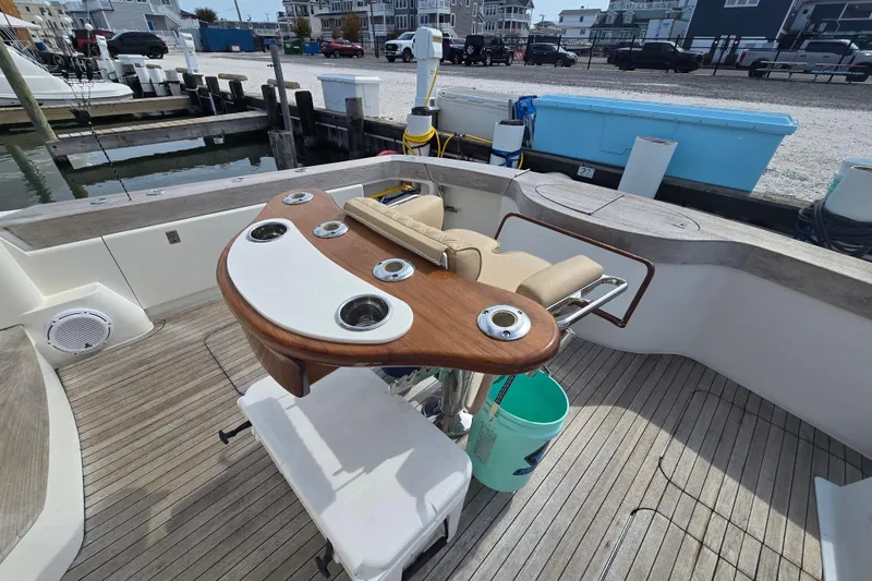 Slide: The Image of 2004 Ocean Yachts 50 Super Sport fishing cockpit with rod holders and seating. - 44