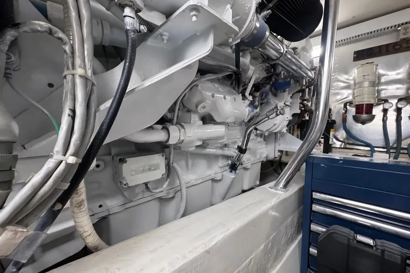 Slide: The Image of Engine room of a 2004 Ocean Yachts 50 Super Sport, showcasing mechanical components. - 49