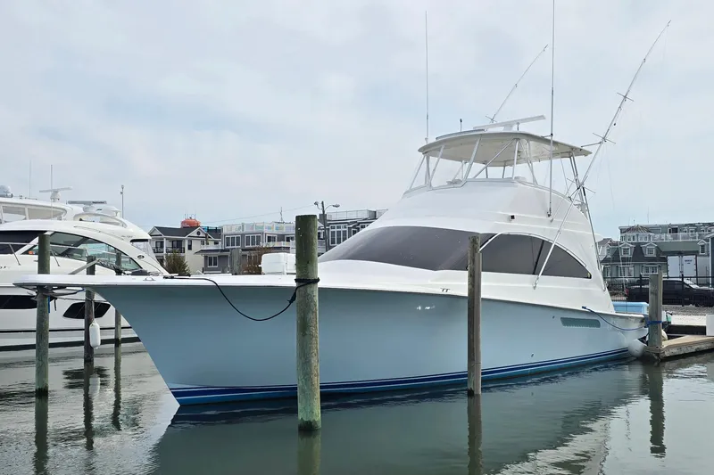 Slide: The Image of 2004 Ocean Yachts 50 Super Sport docked in a marina. - 9
