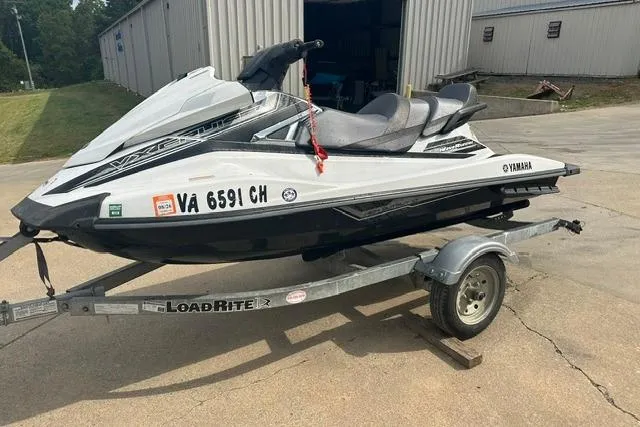 Slide: The Image of 2016 Yamaha WaveRunner VX Cruiser on trailer, parked outdoors near a building. - 6