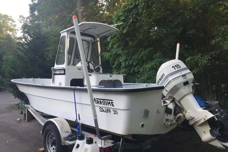Slide: The Image of 1993 Maritime Skiff 2090cc boat with Johnson 115 outboard motor on trailer. - 5