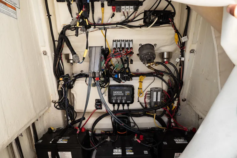 Slide: The Image of Electrical wiring and components inside a 2023 World Cat 235 CC boat. - 14