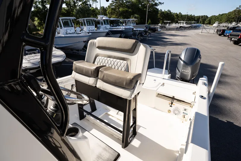 Slide: The Image of 2023 World Cat 235 CC boat interior with dual seating and Yamaha 150 engine. - 15