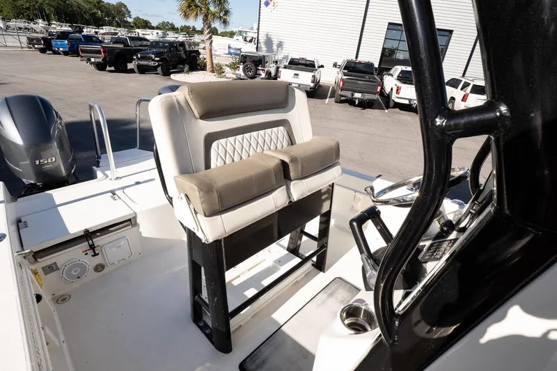 Slide: The Image of 2023 World Cat 235 CC boat interior with seating and steering console. - 16