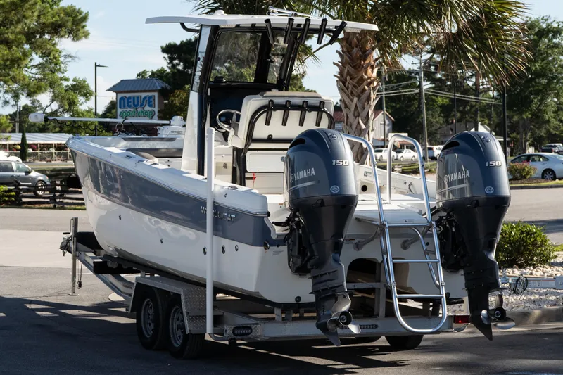 Slide: The Image of 2023 World Cat 235 CC boat with dual Yamaha 150 engines on a trailer. - 5