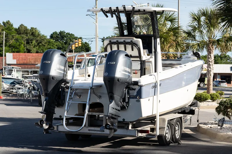 Slide: The Image of 2023 World Cat 235 CC boat with dual Yamaha 150 engines on a trailer. - 7