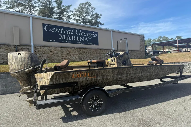 The Image of 2026 Excel 206 Stalker CC boat at Central Georgia Marina, featuring camouflage design and trailer. - 1
