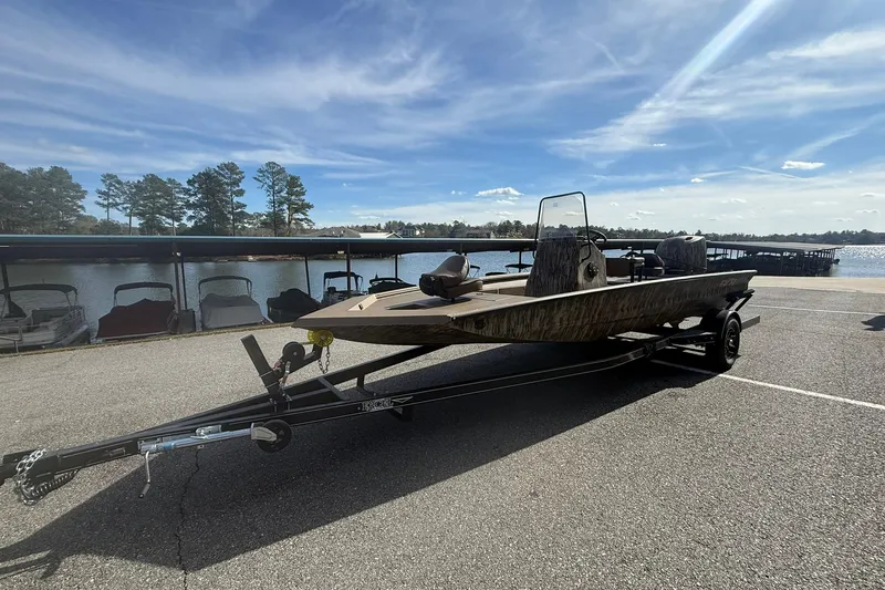 Slide: The Image of 2026 Excel 206 Stalker CC boat on trailer by a lake under a clear sky. - 5