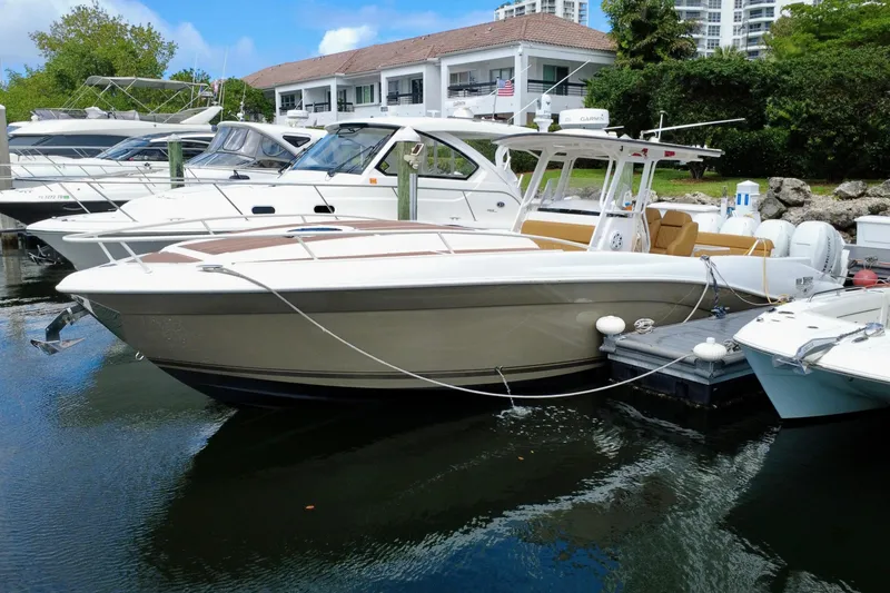 The Image of 2011 Deep Impact 36 Open boat docked at marina with other vessels. - 0