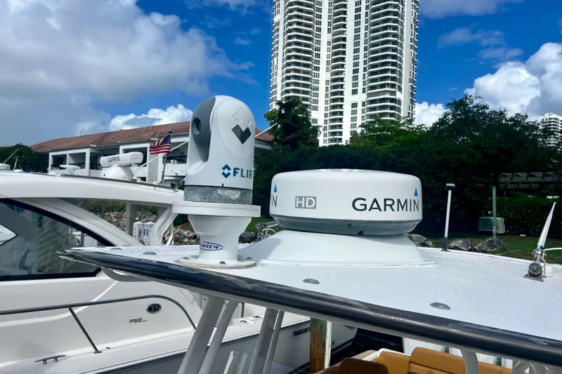 Slide: The Image of 2011 Deep Impact 36 Open boat with Garmin and FLIR equipment, docked near high-rise buildings. - 17