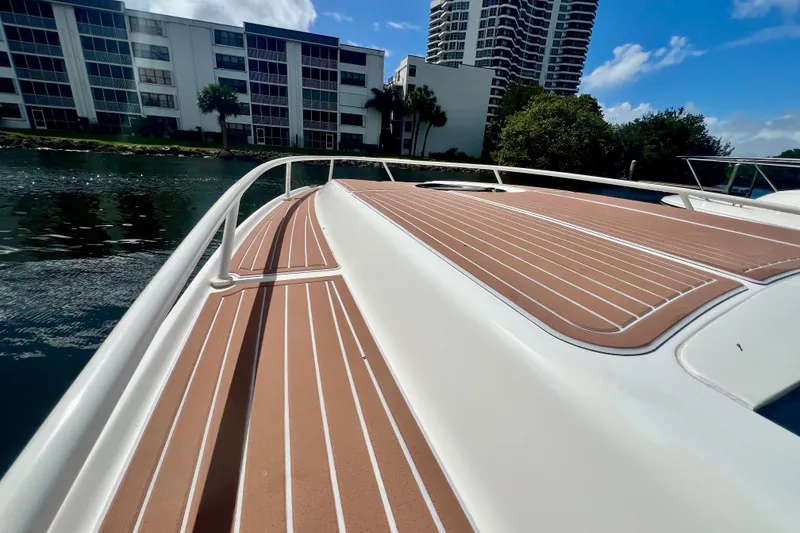 Slide: The Image of 2011 Deep Impact 36 Open boat deck with waterfront view and modern buildings. - 18