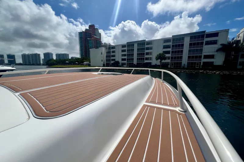 Slide: The Image of 2011 Deep Impact 36 Open boat deck with cityscape background under a sunny sky. - 19