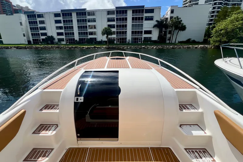 Slide: The Image of 2011 Deep Impact 36 Open boat docked near waterfront buildings. - 21