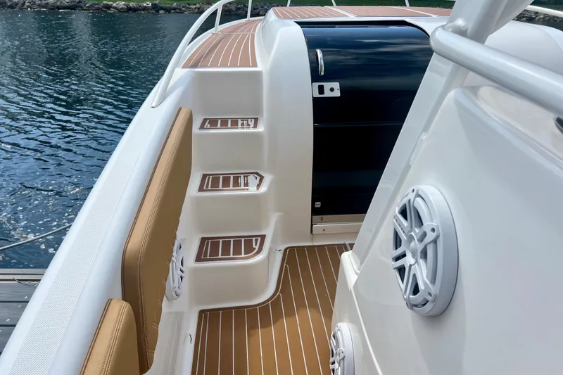 Slide: The Image of 2011 Deep Impact 36 Open boat interior with teak flooring and marine speakers. - 32