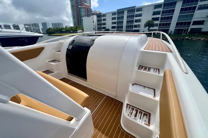 Slide: The Image of 2011 Deep Impact 36 Open boat interior with tan seating and wooden flooring. - 35