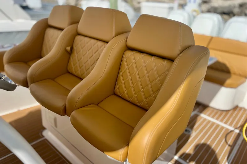 Slide: The Image of Luxurious tan leather seats on a 2011 Deep Impact 36 Open boat. - 41