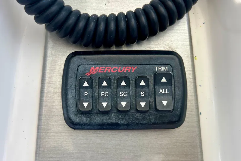 Slide: The Image of Mercury trim control panel on 2011 Deep Impact 36 Open boat. - 46