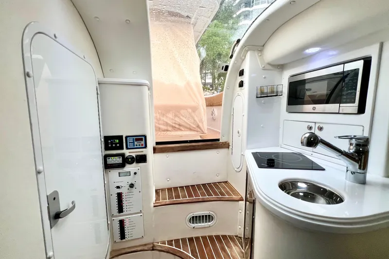 Slide: The Image of Interior of 2011 Deep Impact 36 Open boat with modern kitchen amenities. - 51