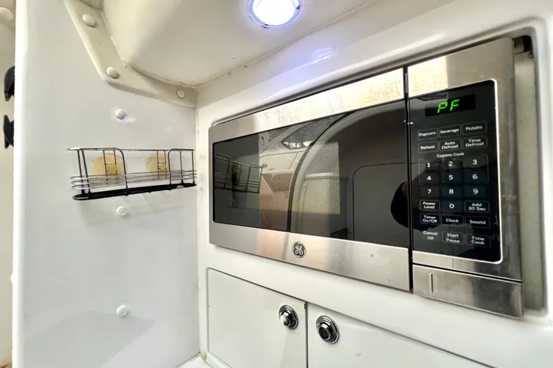 Slide: The Image of Microwave in 2011 Deep Impact 36 Open boat interior, featuring sleek design and modern controls. - 52