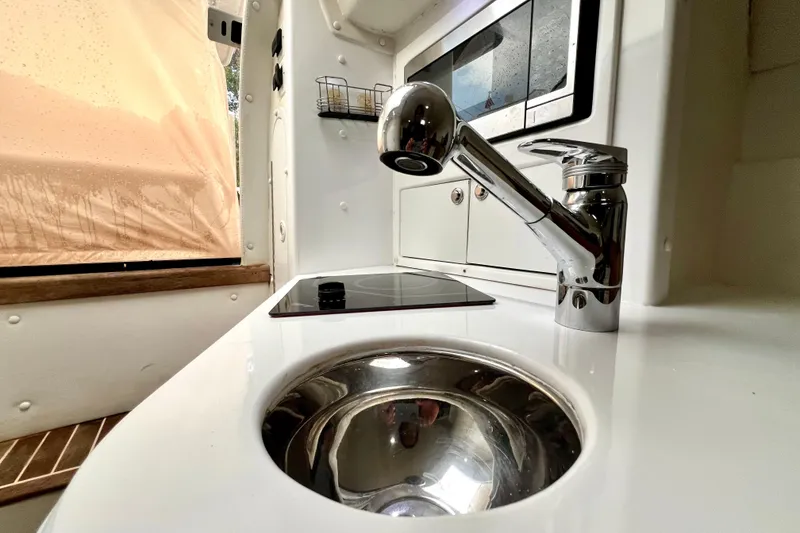 Slide: The Image of Interior of 2011 Deep Impact 36 Open boat with modern sink and stove. - 54
