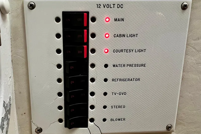 Slide: The Image of 2011 Deep Impact 36 Open boat control panel with switches and indicator lights. - 58
