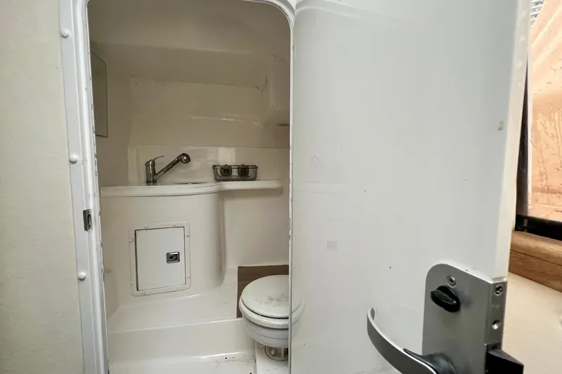 Slide: The Image of 2011 Deep Impact 36 Open boat bathroom with sink and toilet. - 59