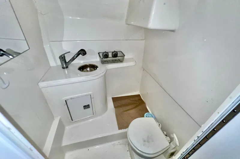 Slide: The Image of Compact bathroom in 2011 Deep Impact 36 Open boat, featuring sink and toilet. - 60