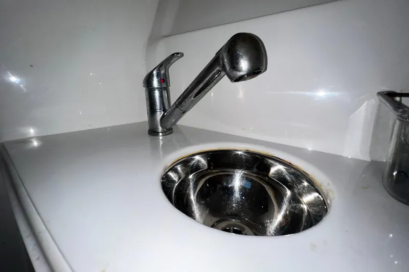 Slide: The Image of Stainless steel sink and faucet on 2011 Deep Impact 36 Open boat. - 61