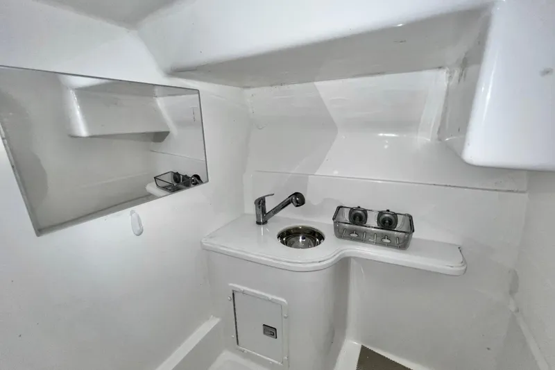 Slide: The Image of 2011 Deep Impact 36 Open boat interior with sink and mirror. - 62