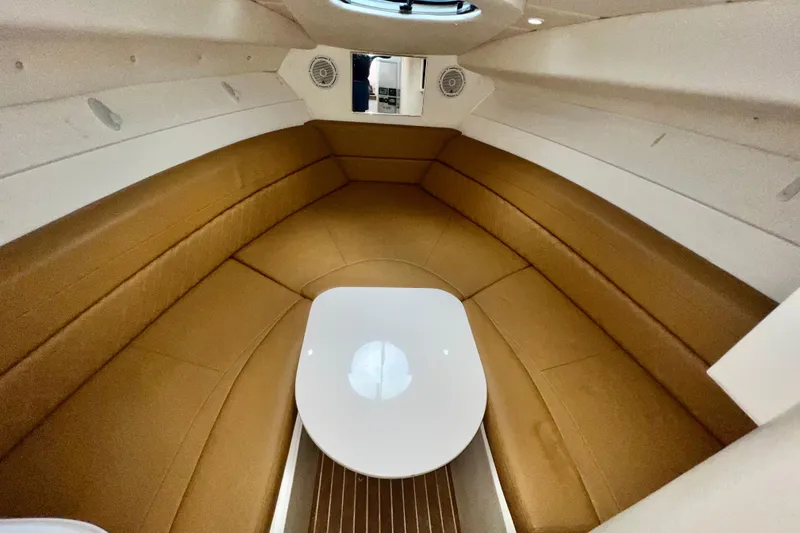 Slide: The Image of Interior of 2011 Deep Impact 36 Open boat with tan seating and white table. - 65